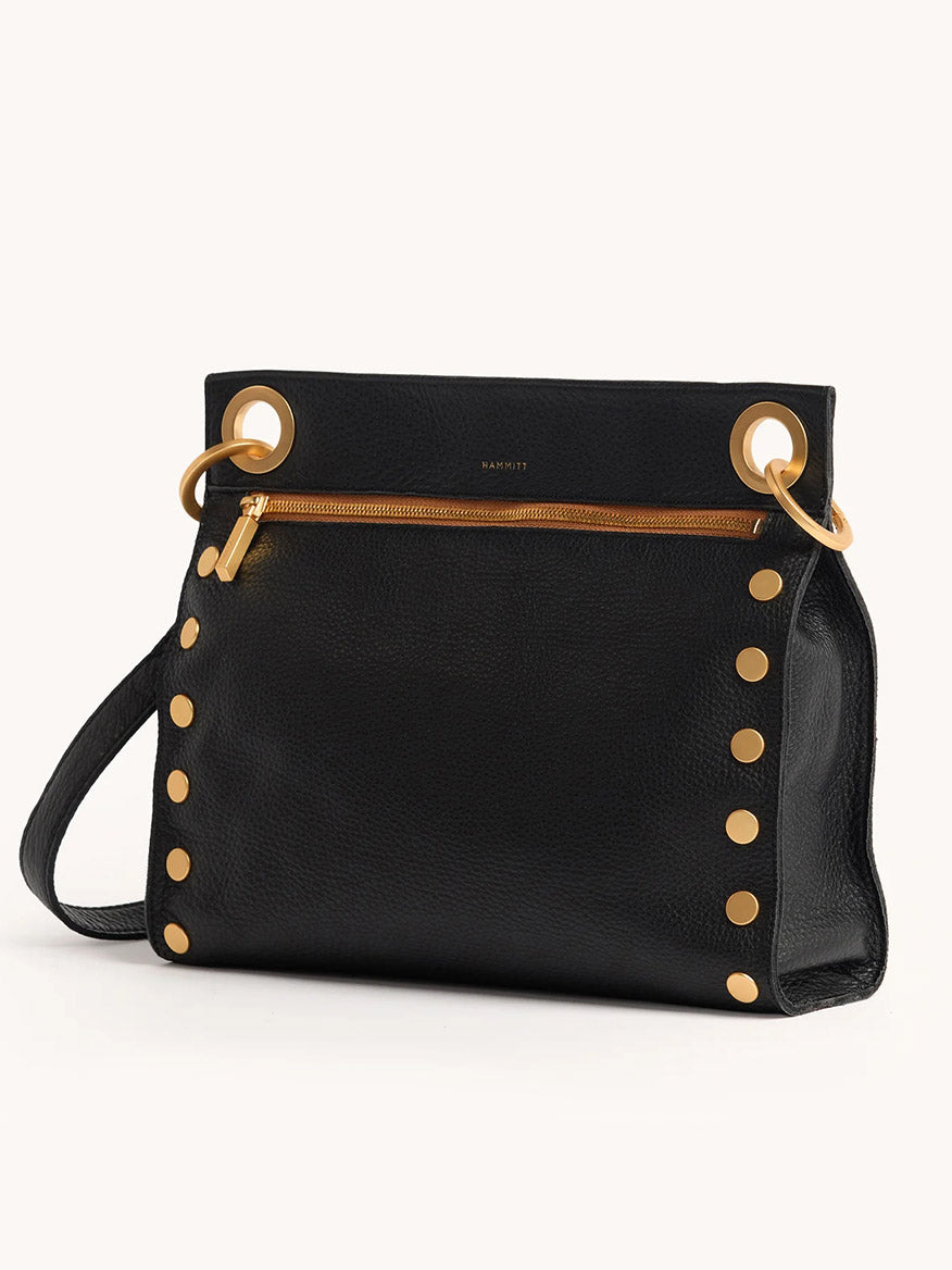 The Hammitt Los Angeles Tony Large Crossbody Bag in North End features black leather, gold studs and hardware, a front gold zipper pocket, and a detachable, adjustable strap.