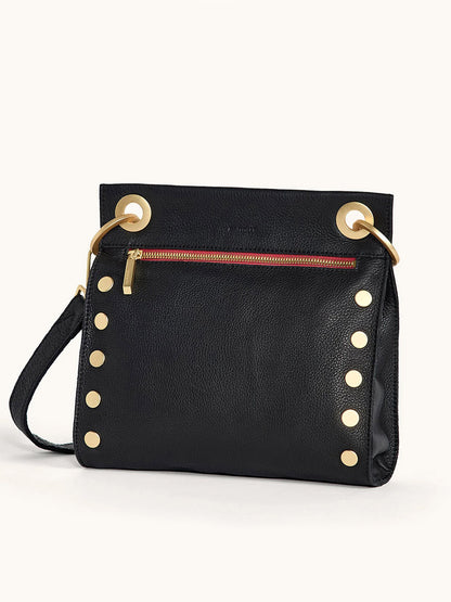 The Hammitt Los Angeles Tony Medium Crossbody Bag in Black/Brushed Gold/Red Zip features black leather, gold studs and hardware, a red front zipper pocket, and a detachable strap—the ideal everyday accessory.
