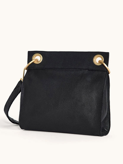 The Hammitt Los Angeles Tony Medium Crossbody Bag in Black/Brushed Gold/Red Zip features a black leather design with gold accents and a matching strap, displayed against a plain light background.