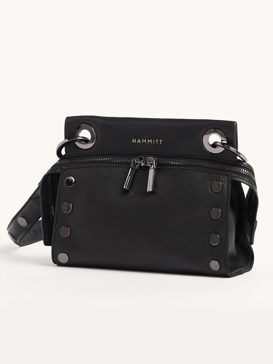 The Hammitt Los Angeles Tony Signature Small Crossbody in black features black pebbled leather with silver studs, dual zippers, and a logo label. It includes an adjustable strap for comfort and versatility.