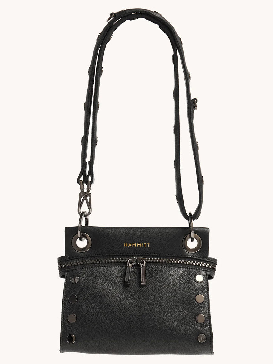 The Hammitt Los Angeles Tony Signature Small Crossbody in Black is an elegant bag crafted from black pebbled leather, featuring two front zippers, subtle stud detailing, and an adjustable strap for personalized comfort.