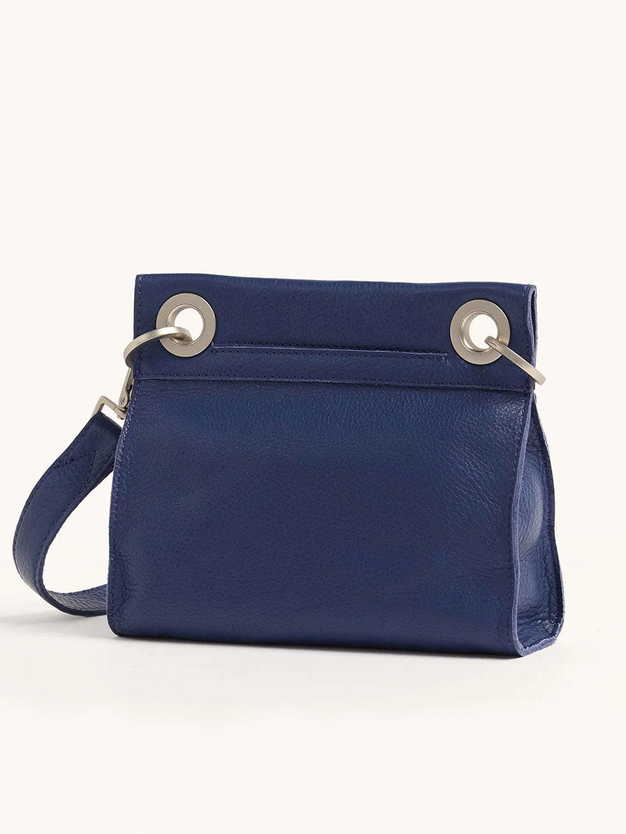 The Hammitt Los Angeles Tony Small Crossbody Bag in Jazz Blues features blue pebbled leather, an adjustable strap, and metal ring details, displayed against a plain white background.