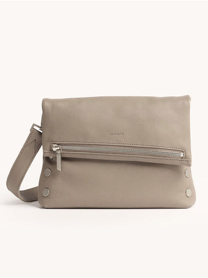 The Hammitt Los Angeles VIP Medium Clutch in pewter pebble leather features a wrist strap, front zipper pocket, silver hardware, and removable crossbody strap, shown against a plain light background.