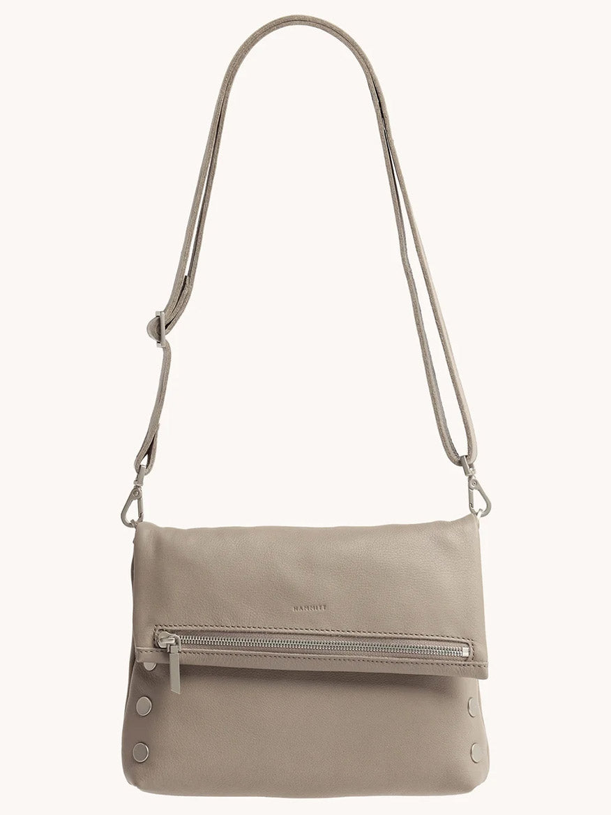 The Hammitt Los Angeles VIP Medium Clutch in Pewter Pebble features a front zipper pocket, silver-tone hardware, and an adjustable, removable crossbody strap.