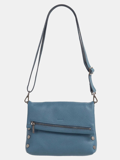 The Hammitt Los Angeles VIP Medium Clutch in Curated Blue is a leather crossbody bag with a zippered front pocket and an adjustable, removable strap for versatile styling.