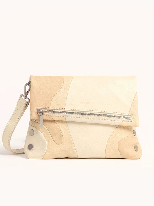 The Hammitt Los Angeles VIP Medium Clutch in Coastal Cream is a beige and cream leather clutch with a fold-over design, front zipper pocket, optional detachable wrist strap, and elegant Coastal Pebble finish.