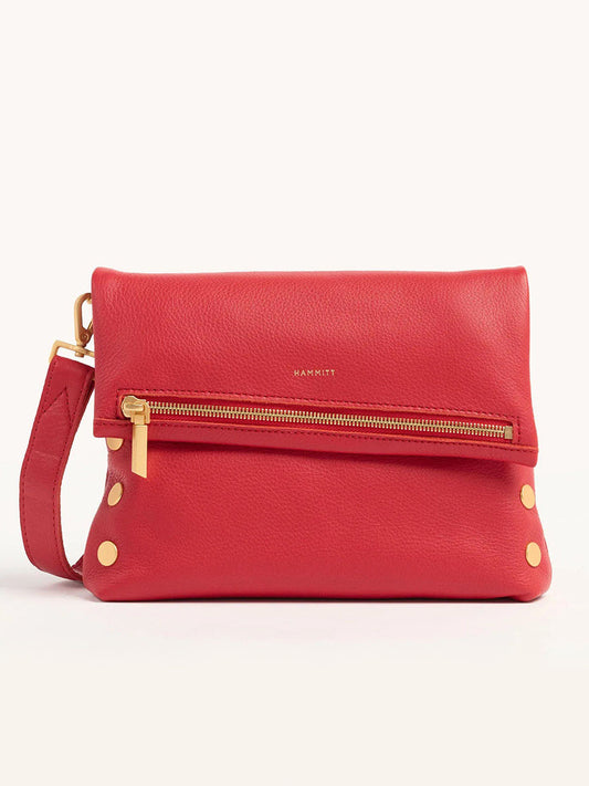 The Hammitt Los Angeles VIP Medium Clutch in poppy red is crafted from leather, with a front zipper, gold hardware, and an adjustable strap for use as a crossbody bag.