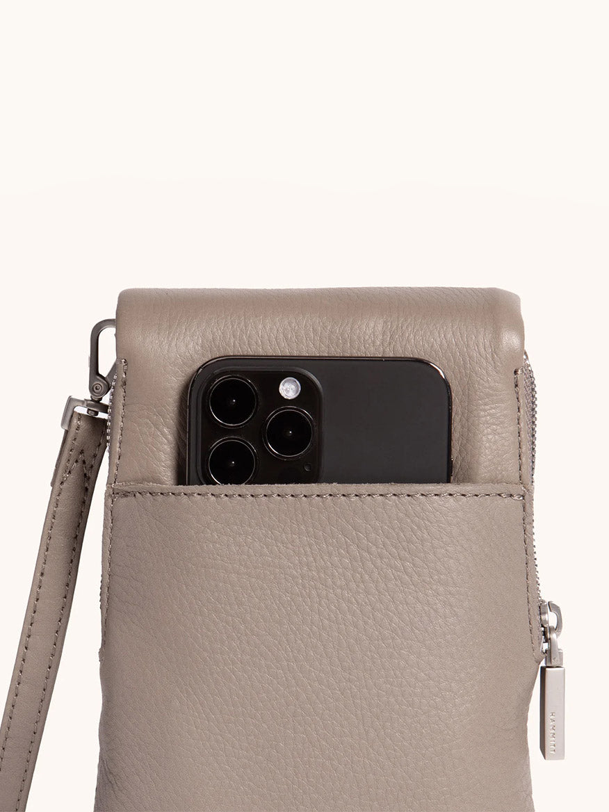 The Hammitt Los Angeles VIP Mobile in Pewter/Brushed Silver features pebbled leather, a silver zipper and strap, and includes a dedicated cellphone pocket perfectly sized for your black smartphone.