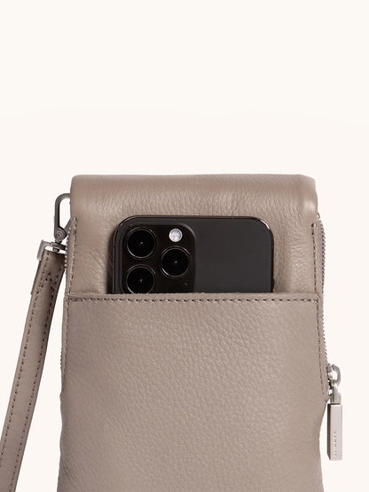 The Hammitt Los Angeles VIP Mobile in Pewter/Brushed Silver features pebbled leather, a silver zipper and strap, and includes a dedicated cellphone pocket perfectly sized for your black smartphone.