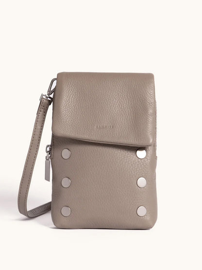 Meet your new favorite: the Hammitt Los Angeles VIP Mobile in Pewter/Brushed Silver, featuring pebbled leather, a fold-over flap, silver hardware, six round front studs, wrist strap, and a convenient cellphone pocket.