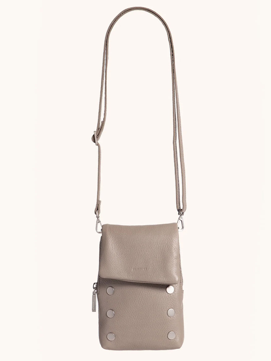 The Hammitt Los Angeles VIP Mobile in Pewter/Brushed Silver is a pebbled leather crossbody bag with an adjustable strap, front flap with six metal studs, and a convenient side pocket for your cellphone.