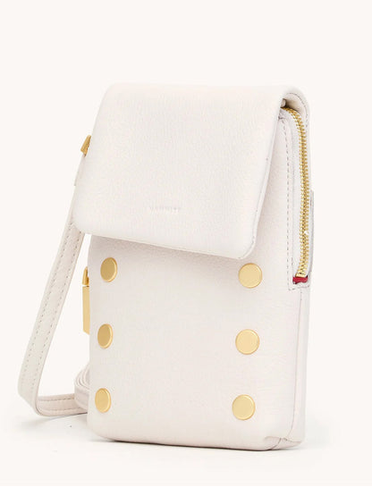 The Hammitt Los Angeles VIP Mobile in Calla Lily White/Brushed Gold is a compact white crossbody bag featuring pebble leather, a flap closure, brushed gold studs on the front, and a side zipper detail.