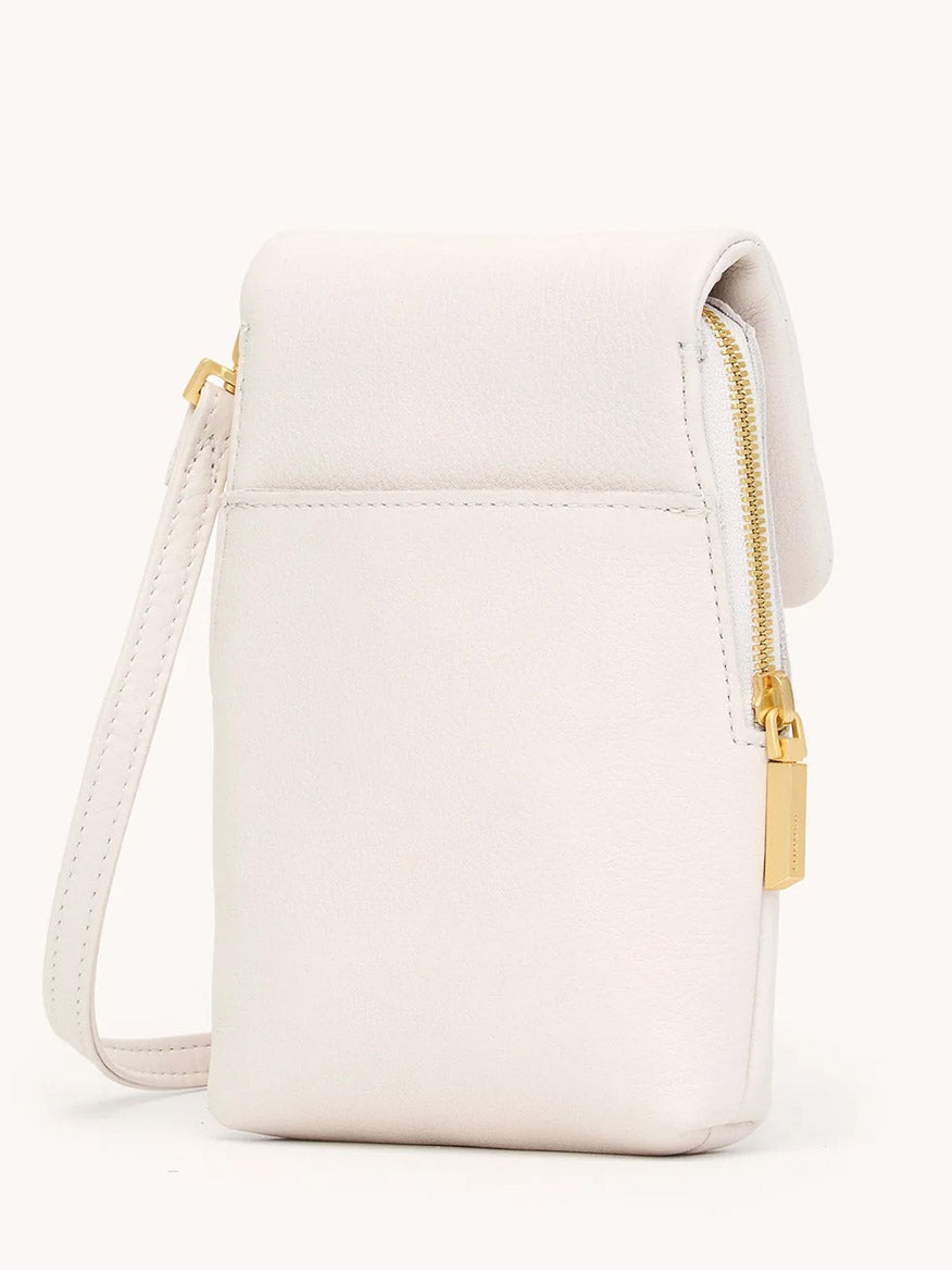 The Hammitt Los Angeles VIP Mobile in Calla Lily White/Brushed Gold, a small white pebble leather wristlet bag with a gold zipper and rectangular pull tab, is photographed against a plain light background.