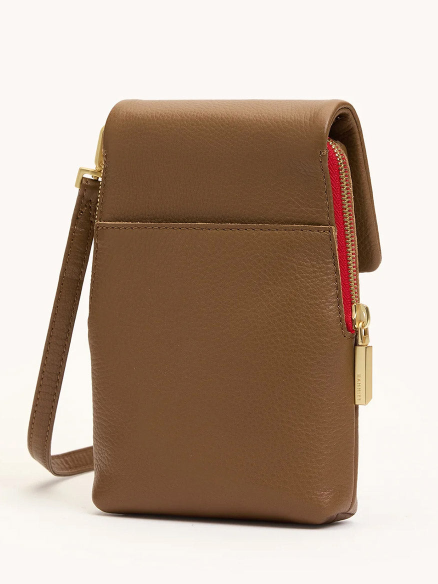 The Hammitt Los Angeles VIP Mobile in Mahogany Pebble with brushed gold hardware and a red zip features a front pocket, cellphone slot, and compact rectangular shape—an ideal crossbody accessory.