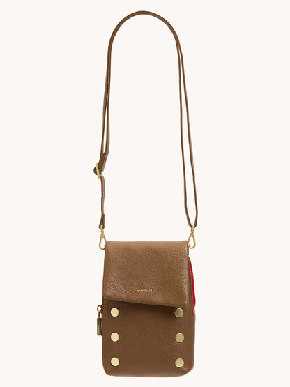 The Hammitt Los Angeles VIP Mobile in Mahogany Pebble with brushed gold hardware features an adjustable strap, front flap, six metal studs, a cellphone pocket, and a signature red zip—your perfect crossbody essential.