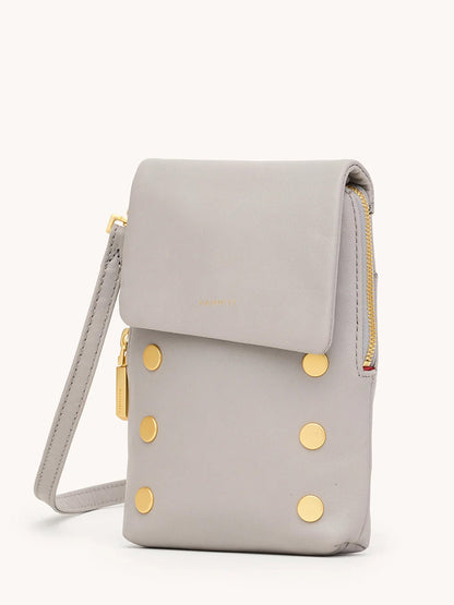 The Hammitt Los Angeles VIP Mobile in Stormy/Brushed Gold is a light gray, soft pebble leather wristlet pouch with a flap closure, gold zipper, and six round brushed gold studs on the front.