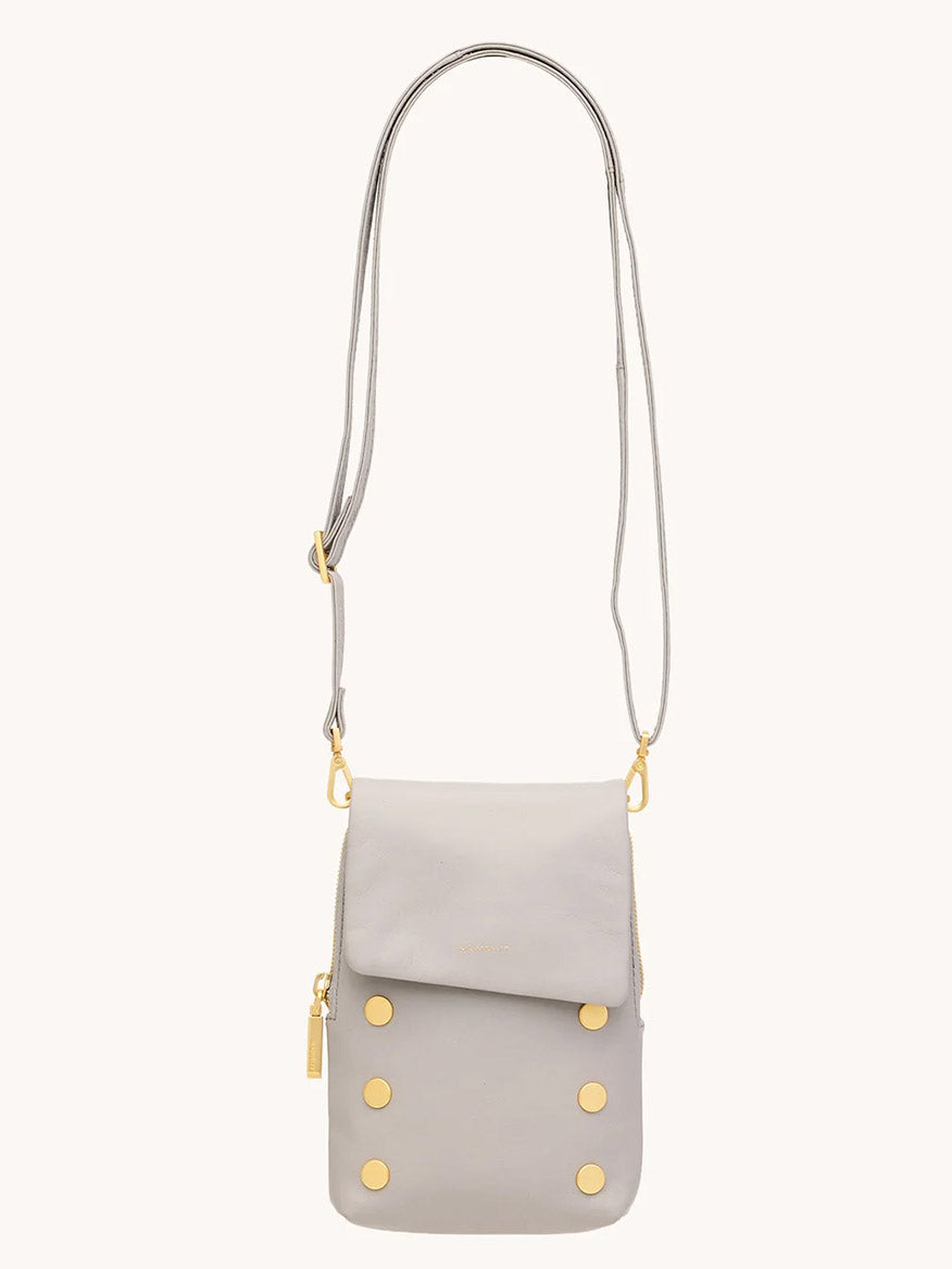 The Hammitt Los Angeles VIP Mobile in Stormy/Brushed Gold is a grey crossbody bag with gold accents, crafted from premium pebble leather.