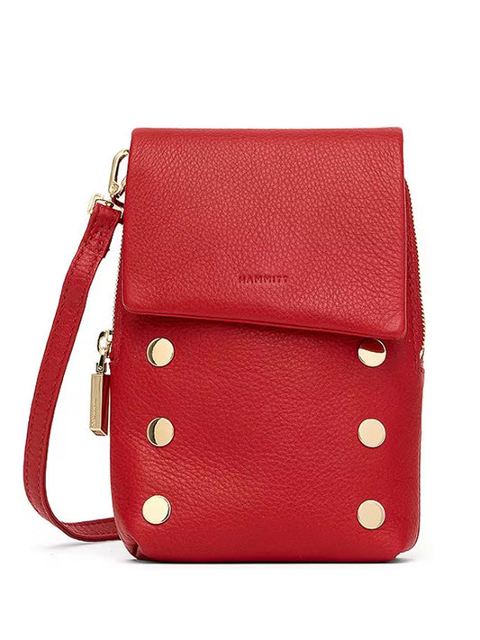 The Hammitt Los Angeles VIP Mobile in Chili Red/Gold is a small crossbody bag crafted from red pebble leather, featuring six gold studs on the front flap and a matching red strap.
