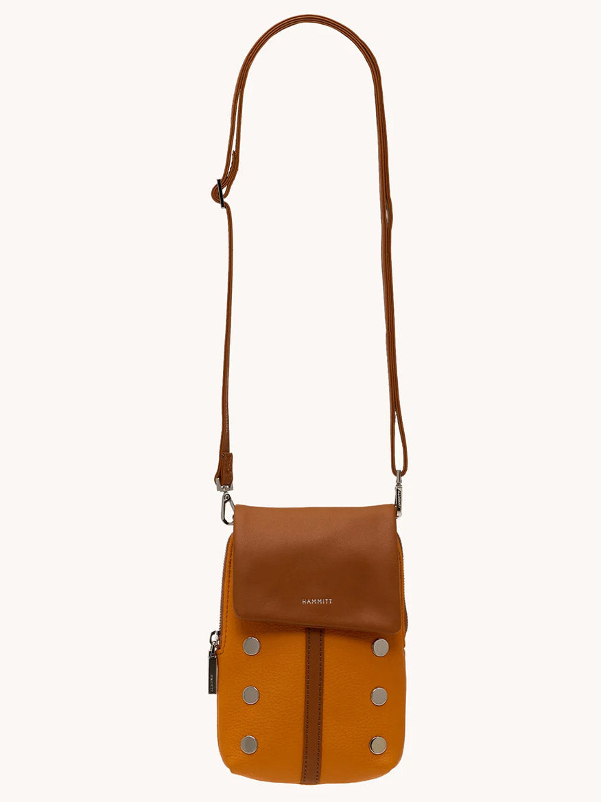 The Hammitt Los Angeles VIP Mobile in Tailored Tangerine/Silver is a stylish crossbody with a tangerine body, silver studs, front zipper pocket, brown adjustable strap and flap, plus a spacious cellphone pocket.
