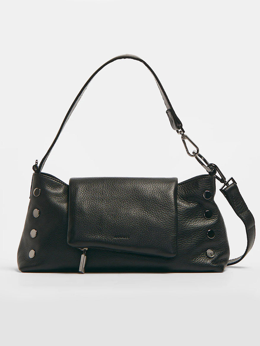 The Hammitt Los Angeles VIP Satchel in Black/Gunmetal is a black pebbled leather shoulder bag with a textured finish, featuring an adjustable and removable crossbody strap. It boasts metallic button accents on the sides and a front flap pocket with a zipper, making it perfect for those seeking a sleek yet functional accessory.
