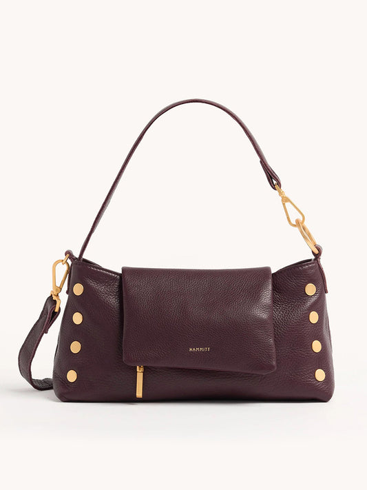 The Hammitt Los Angeles VIP Satchel in Cabernet Pebble is a burgundy shade handbag with a brown leather finish, shoulder strap, gold buttons, and a front flap pocket.