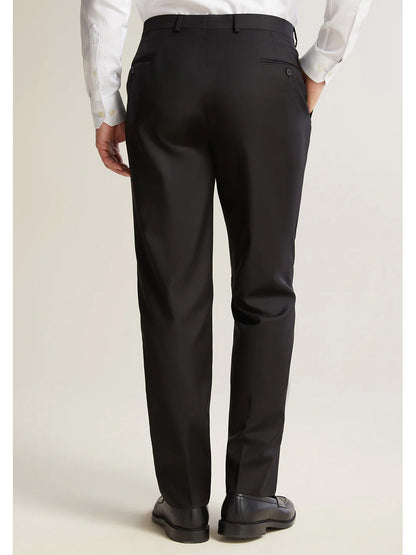 Seen from behind, a person stands on a neutral background wearing the Hickey Freeman (Heritage Gold) Black Infinity Suit, featuring black dress pants crafted from Carlo Barbera mill's exquisite Super 140s Infinity wool.