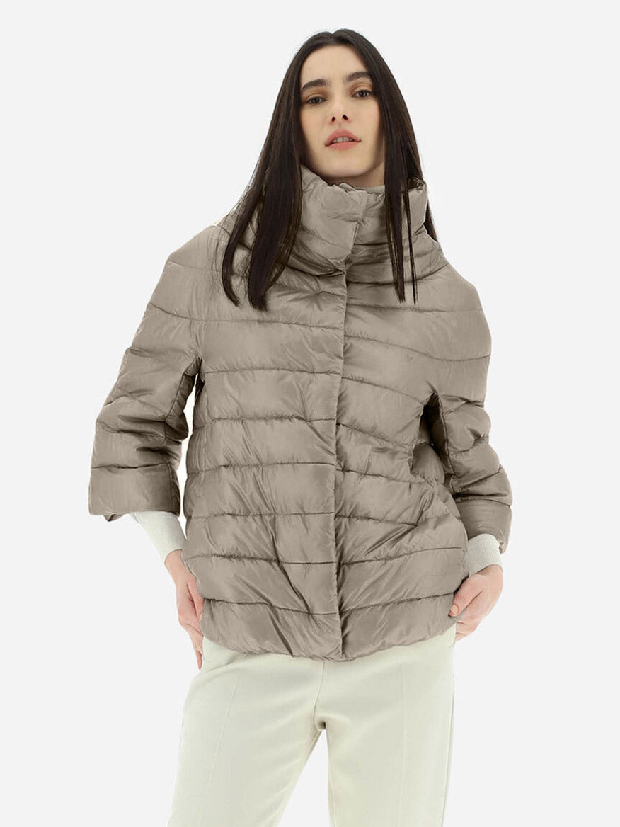 The model is wearing a Herno Aminta 3/4 Sleeve Cocoon Jacket in Taupe.