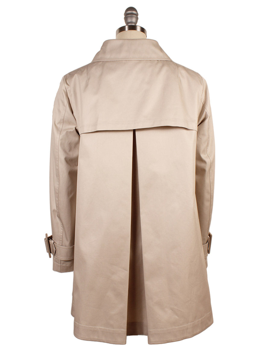 The Herno Delon and Monogram Trench Coat in Champagne, made from cotton gabardine with a back vent and buckled cuffs, is displayed on a mannequin.