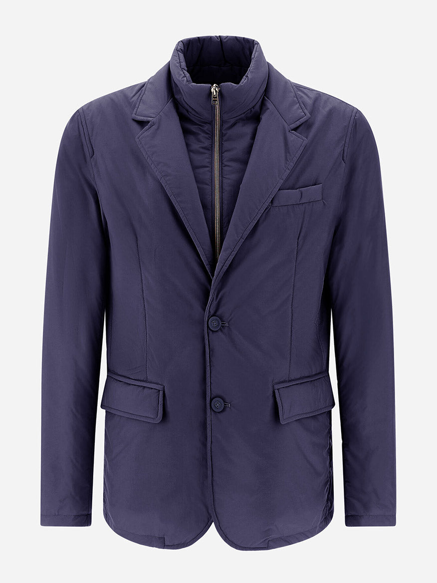 The Herno Blazer in Ecoage, in a shade of new blue, is designed with two buttons, flap pockets, and a notched lapel. Made from recycled nylon microfibre, it includes a zip-up quilted inner lining for additional warmth.