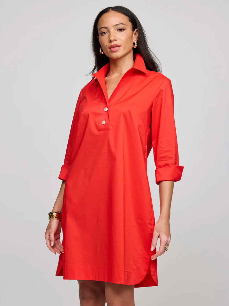 A woman models the Hinson Wu Aileen 3/4 Sleeve Button Back Dress in Scarlet—crafted from stretch polished cotton—for a stylish, comfortable, and durable look against a plain light background.