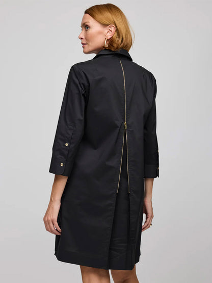 A woman wears the Hinson Wu Alessa 3/4 Sleeve Dress in Black, crafted from Stretch Polished Cotton with three-quarter sleeves and a visible gold zipper down the back.