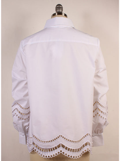 The Hinson Wu Bardot Scalloped Blouse in white, elegantly displayed on a mannequin, features delicate lace-like cutouts with a scalloped hem, embodying sophistication signature to Hinson Wu designs.