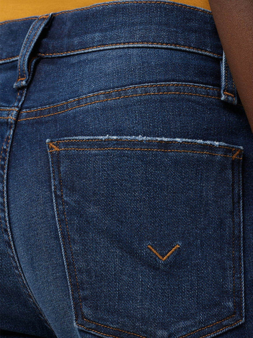Close-up of a Hudson Rosie High-Rise Wide Leg Ankle Jean in Poseidon denim pocket showing stitching details.
