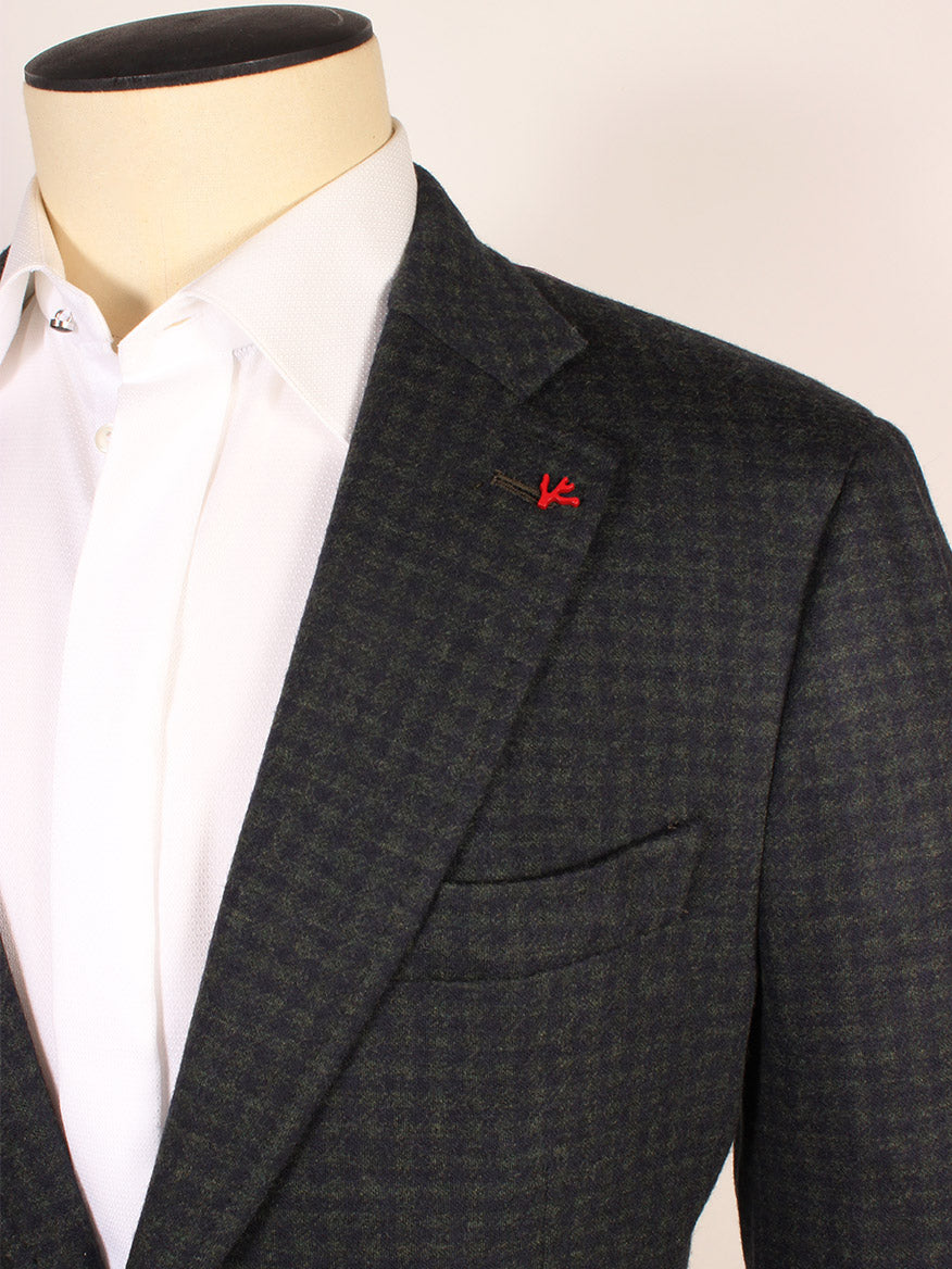 Close-up of a mannequin wearing the Isaia Double-Face Jersey Sport Jacket in Dark Green/Navy Check, styled over a white dress shirt. Features red lapel stitching. Made in Italy.