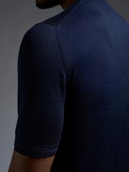 Close-up of a person wearing the Isaia Wool Cashmere Banded Tee in Navy, photographed from the back and slightly to the side.