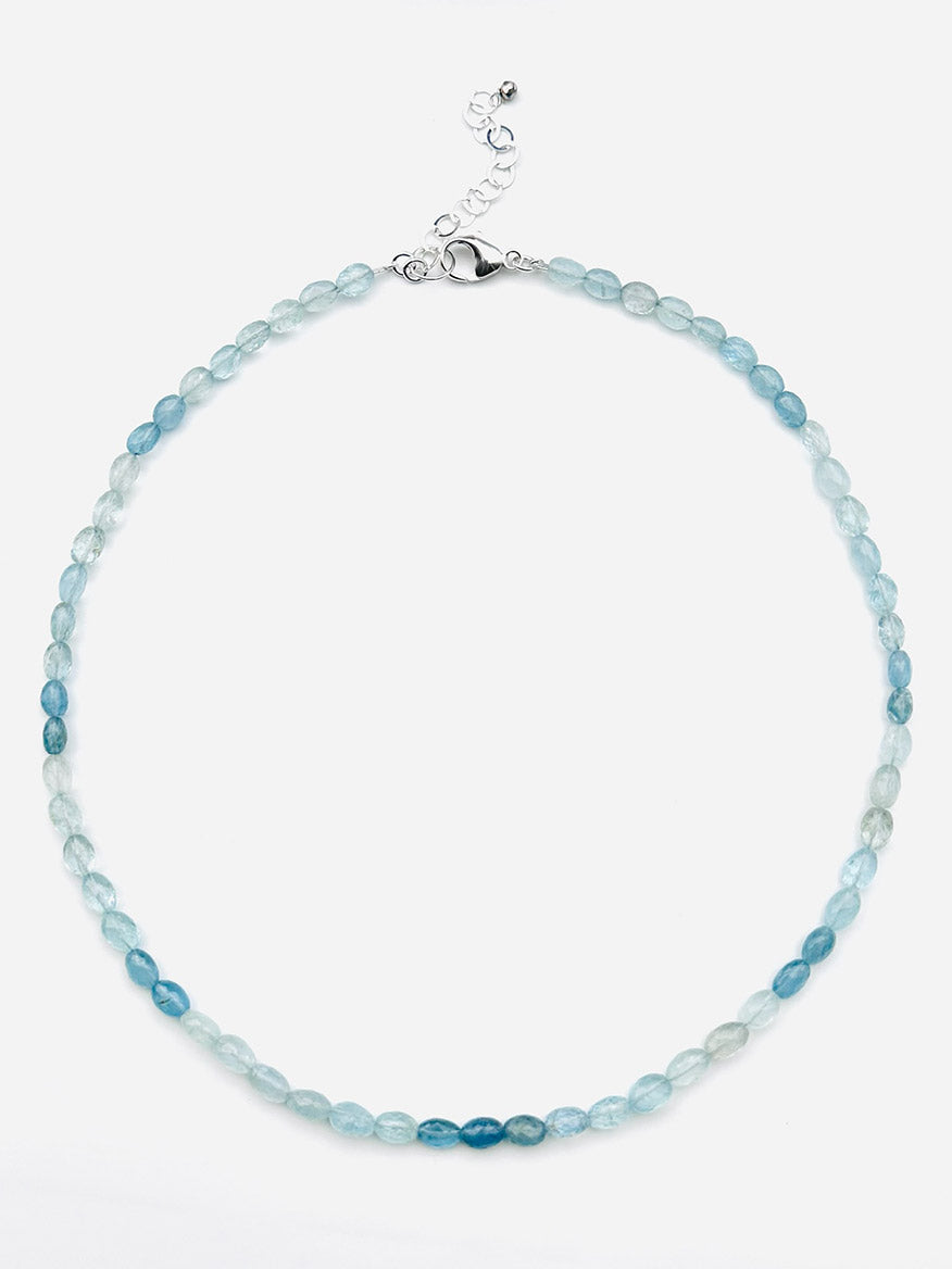 The JMNYC Designs 19" Small Faceted Oval Moss Aquamarine Necklace showcases small, faceted oval moss aquamarine beads and is finished with a sterling silver clasp and adjustable chain.