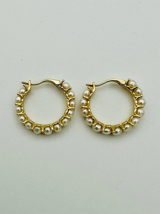 The JMNYC Designs 20mm Freshwater Pearl Hoop Earring with Gold Vermeil features a pair of gold vermeil hoops adorned with small white freshwater pearls evenly spaced around the 20mm outer edge, set against a simple light background.