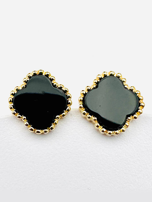 The JMNYC Designs Black Onyx Clover Vermeil Post Earrings, measuring .5", feature a black clover-shaped design with black onyx centers and a gold vermeil beaded trim, displayed against a plain white background.
