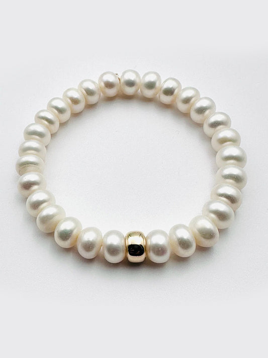 The JMNYC Designs Freshwater Button Pearl Bracelet With Gold Fill Rondelle is shown on a plain white background.