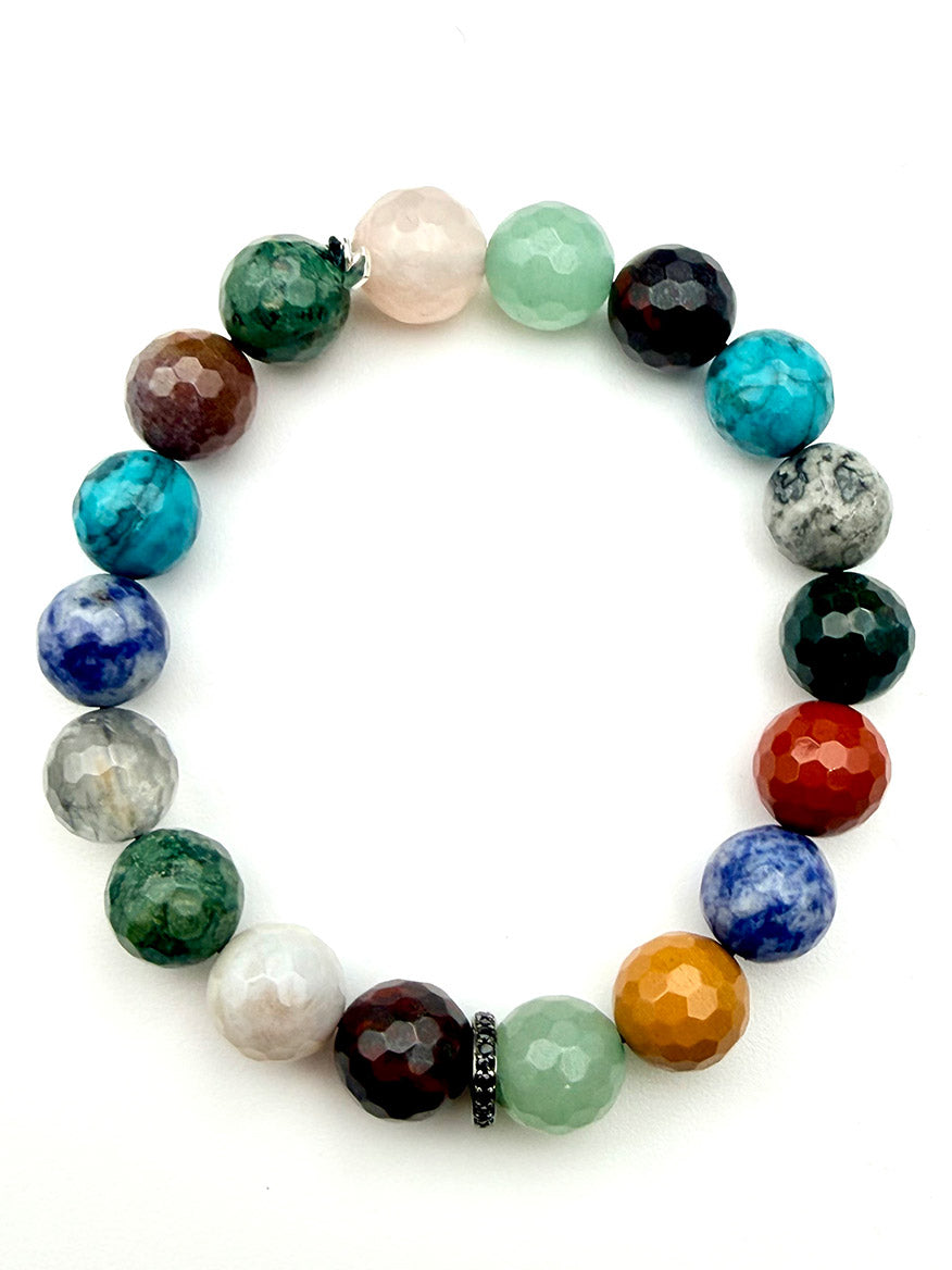 JMNYC Designs Mixed Stone Faceted Ball bracelet featuring multicolored gemstone beads and a single sterling silver Black Spinel rondelle, arranged in a circle on a white background.
