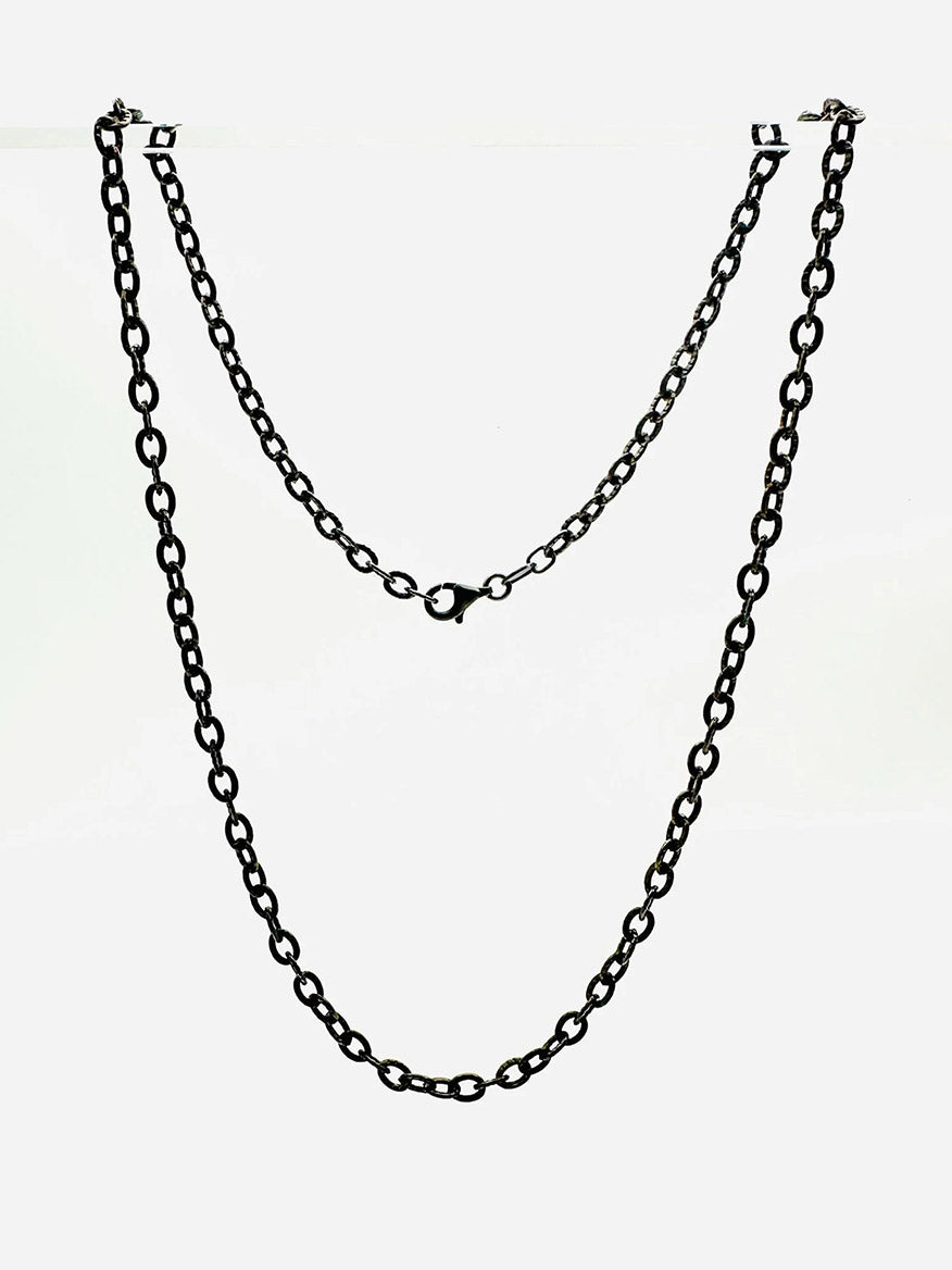 The JMNYC Designs 3mm rhodium plated cable chain with sterling silver, 18" length, features oval links and a central clasp, displayed against a plain white background.