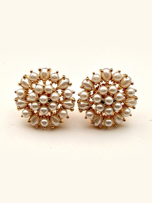 JMNYC Designs' White Freshwater Pearl Gold Fill Flower Shaped Post Earrings (.75") feature a round gold fill design adorned with clusters of small and large freshwater pearls arranged in elegant, concentric floral patterns.