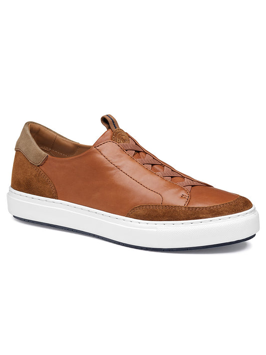 The J & M Collection Anson Stretch Lace-to-Toe sneaker in Cognac English Suede/Sheepskin is a brown leather, retro-style shoe with a cushioned EVA outsole and a white sole, featuring suede and sheepskin accents on the heel and toe.