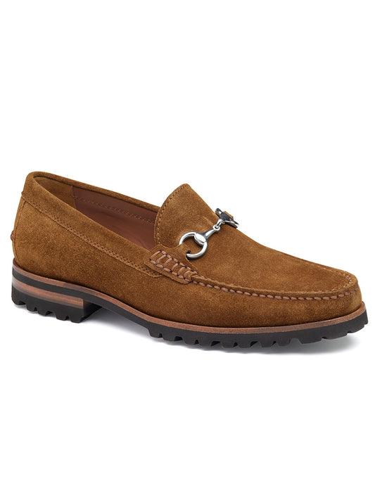 The J & M Collection Baldwin Lug Bit in Snuff English Suede is a brown suede loafer adorned with a metal bit detail, a durable EVA lug outsole, contrast stitching, and complemented by a leather lining for added comfort.