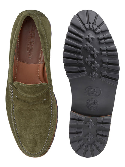 A pair of J & M Collection Baldwin Lug Penny loafers in Olive English Suede; the shoe on the left is displayed upright showing the top view, while the shoe on the right is flipped to display its XL EXTRALIGHT® EVA outsole with a distinct tread pattern.