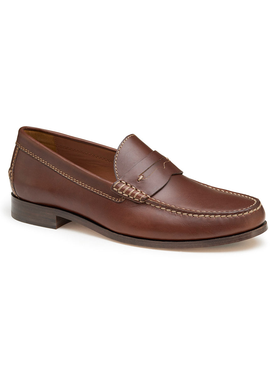 A single J & M Collection Baldwin Penny in Brandy American Full Grain loafer, with its exquisite stitching details, slight heel, and moc-toe design, showcases its quality handsewn moccasin craftsmanship against a plain white background.