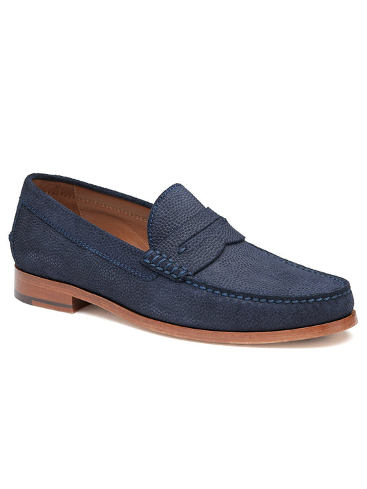 Introducing the J & M Collection Baldwin Penny in Navy English Suede, a dark blue loafers with a brown sole and featuring a textured surface. It is elegantly designed with a penny strap across the top and crafted in a handsewn moccasin style.