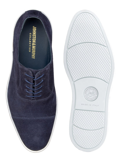 Top and bottom view of the J & M Collection Bolivar Cap in Navy Italian Suede. The left shoe is displayed from the top, while the right shoe is shown from the bottom, revealing the sole's pattern and enhanced cushioning.