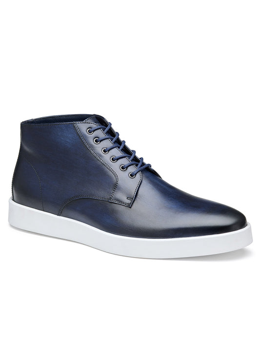 The J & M Collection Bolivar Plain Toe Boot in Navy Hand-Stained Calfskin is a single navy-blue leather sneaker boot with white soles and dark blue laces, featuring an Italian hand-stained calfskin upper and a removable polyurethane footbed.