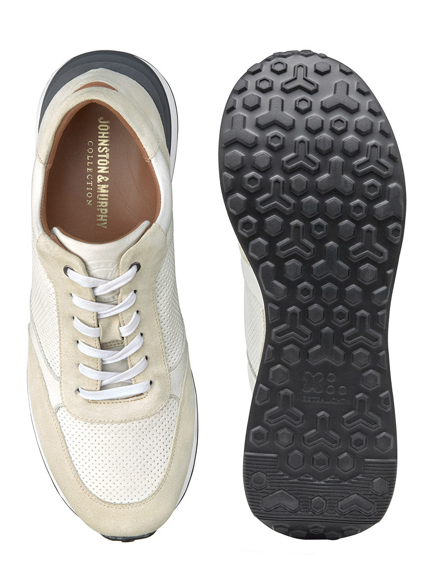 Top-down view of a J & M Collection Briggs Jogger in White Full Grain/Suede sneaker next to its sole showing tread pattern.